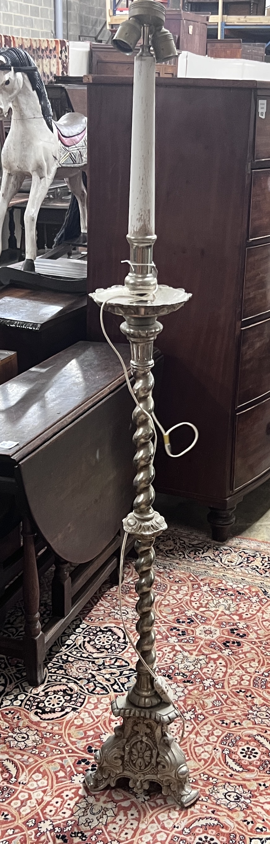 An Italian style cast metal standard lamp, height 165cm